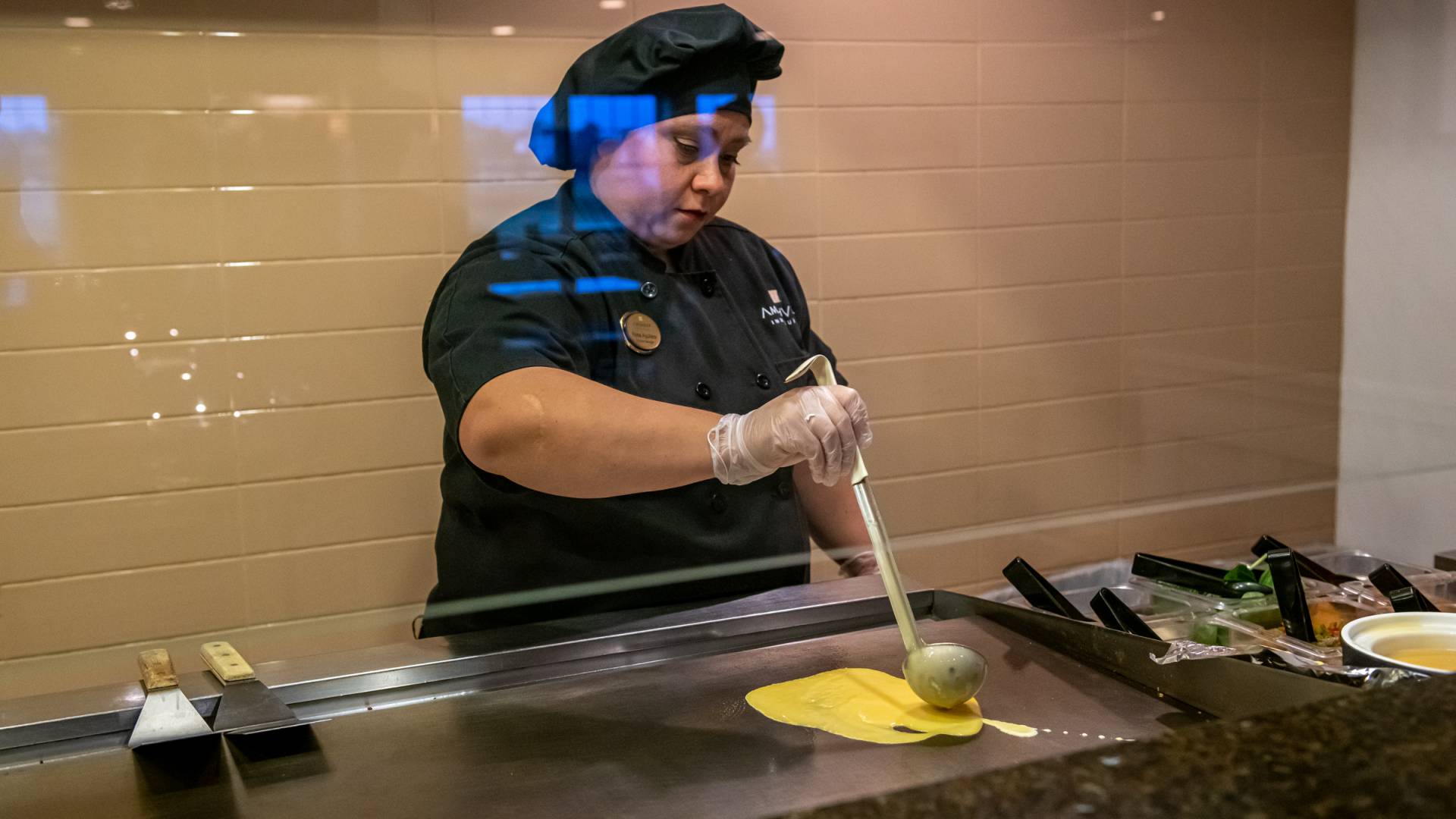 chef cooking eggs for our complimentary breakfast buffet