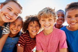 group of kids smiling at the camera